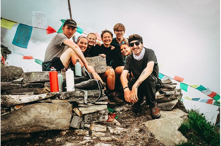 group-picture-of-men-and-women-on-hill-at-daytime